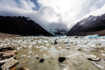 Small blocks of ice dot the shore of a glacial lake at Fitzroy in Argentina