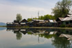 A floating village reflected in Dal Lake, Kashmir