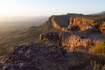 A tourist takes a quiet moment to watch the view from a clifftop in northern Ethiopia