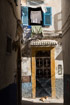 Windows and doorways of different shapes and colours on every house in the old town of Essaouira, Morocco